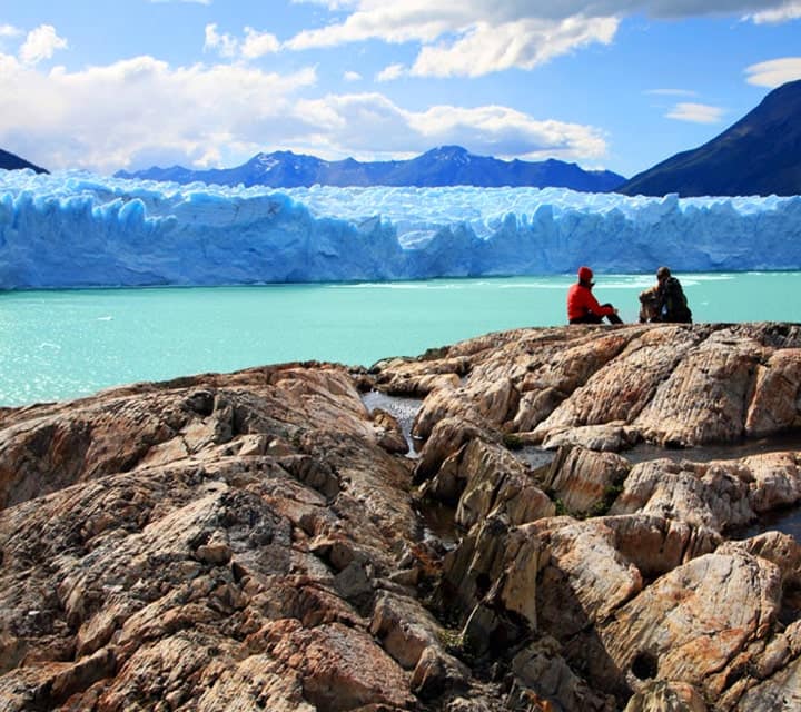 Explorers looking out at Perito Moreno Glacier in Patagonia