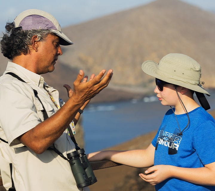 Galapagos Naturalist Guide with child on a Galapagos Family Cruise