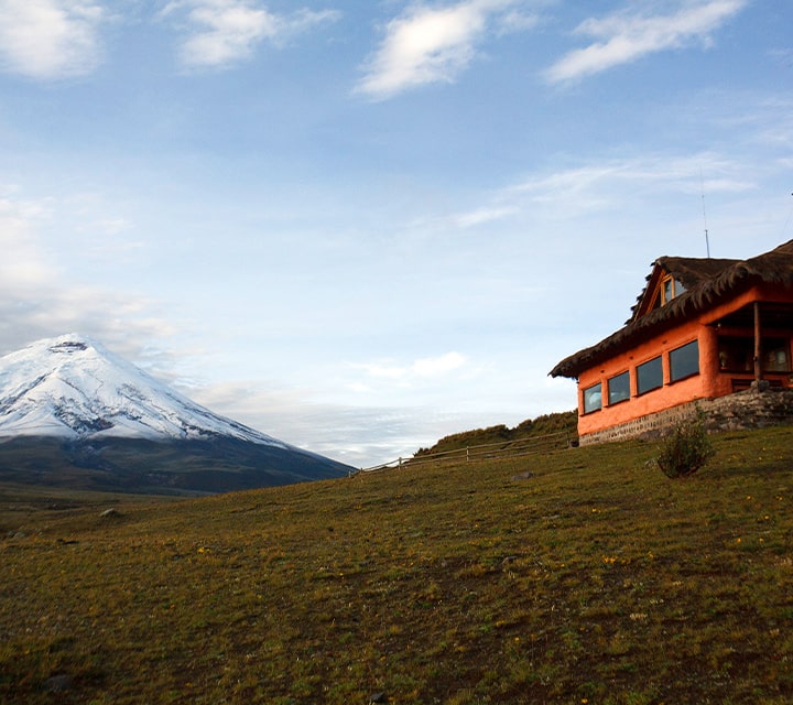 Ecuadorian Highlands picturing estancia and snowtop mountain