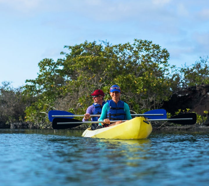 Couple kayaking in the Galapagos Islands