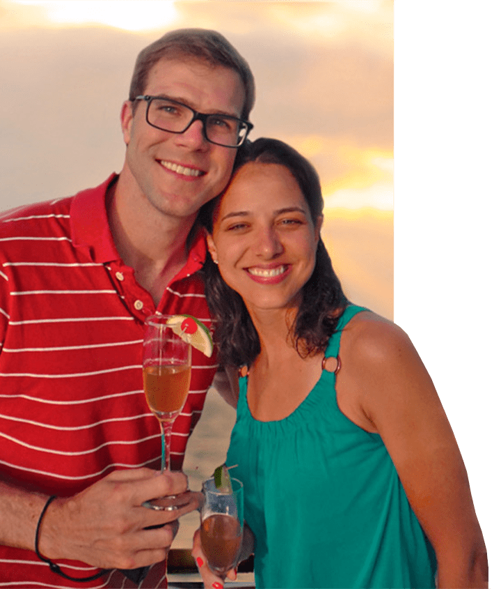 Sunset setting for honeymooners celebrating with champagne