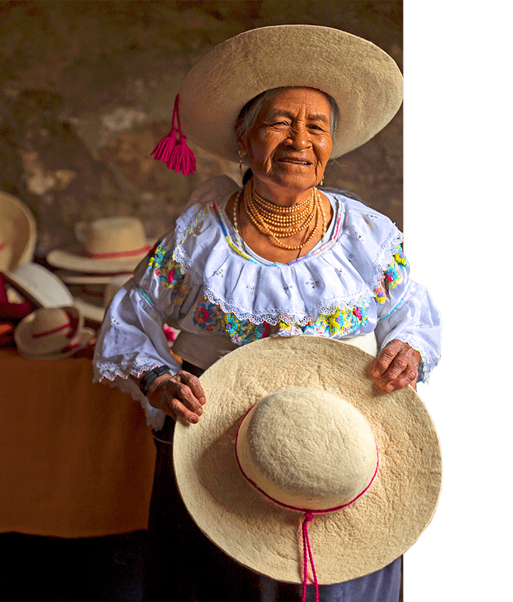 Ecudorian Indigenous elder holding a handmade panama hat