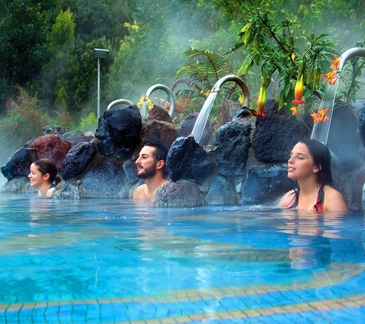 Guests relaxing in a hot pool at Papallacta Springs in Ecuador