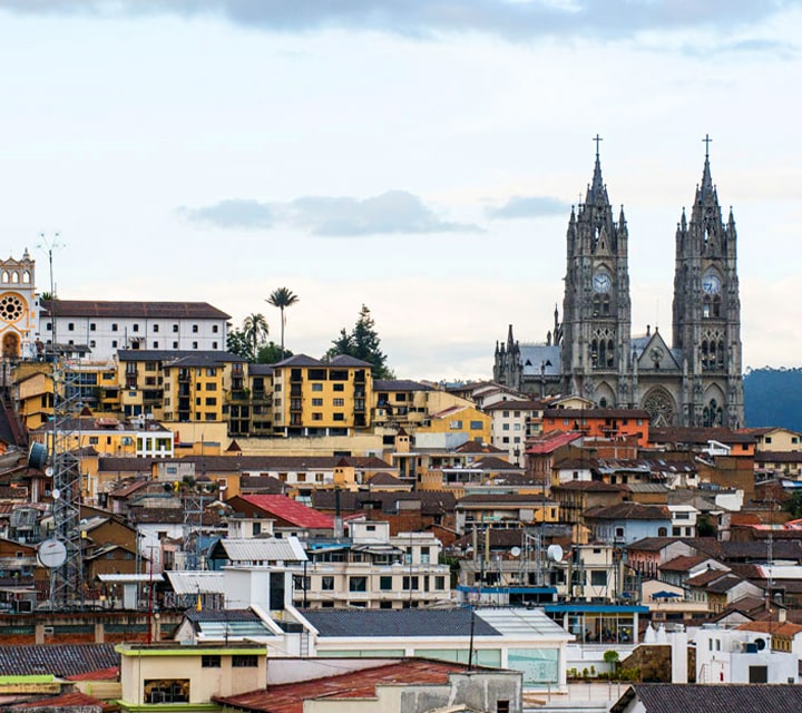 The city of Quito, Ecuador with the clock towers of Basílica del Voto Nacional in the background