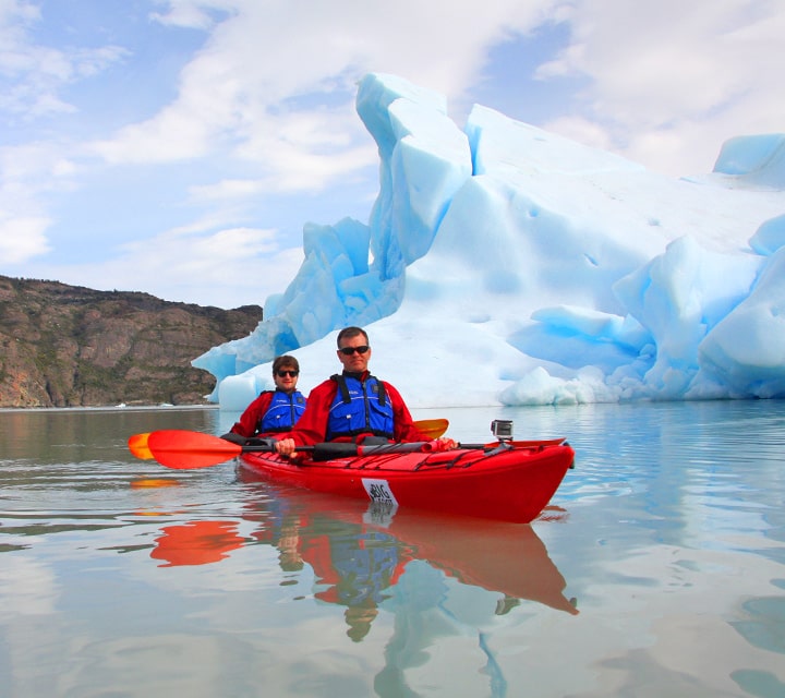 Sea kayaking in grey glacier in Patagonia