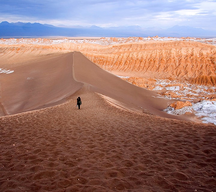 Walking on the sand dunes of the Atacama Desert, Chile