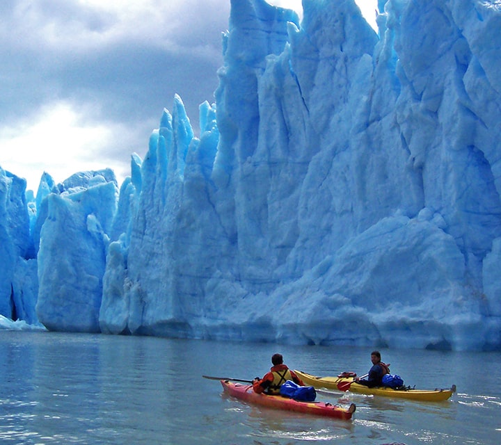 Kayaking by huge glaciers in Patagonia