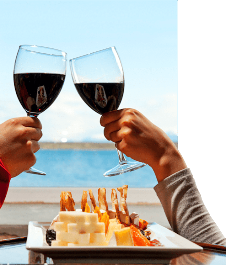 Two people enjoying a Chilean wine delight with an appetizer