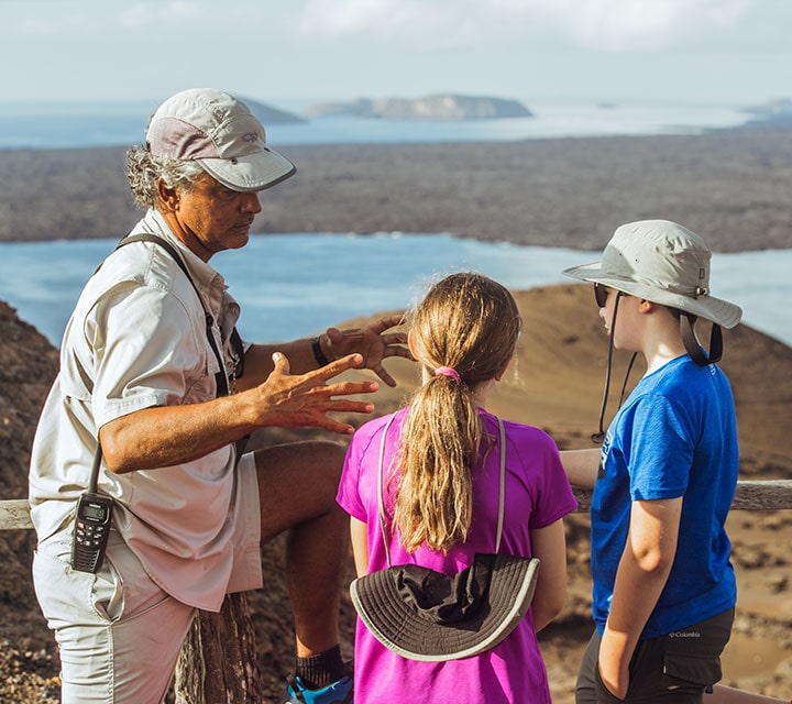 Naturalist Guide explaining the history and geology of the Galapagos Islands to kids
