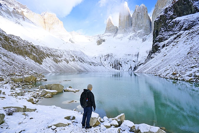 A hiker at the base of Torres del Paine towers in Chile, Patagonia