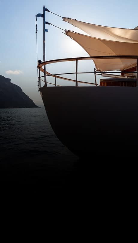 Grace Yacht sailing in Galapagos for luxury private charter - iconic and classic yacht with stunning stern sideview